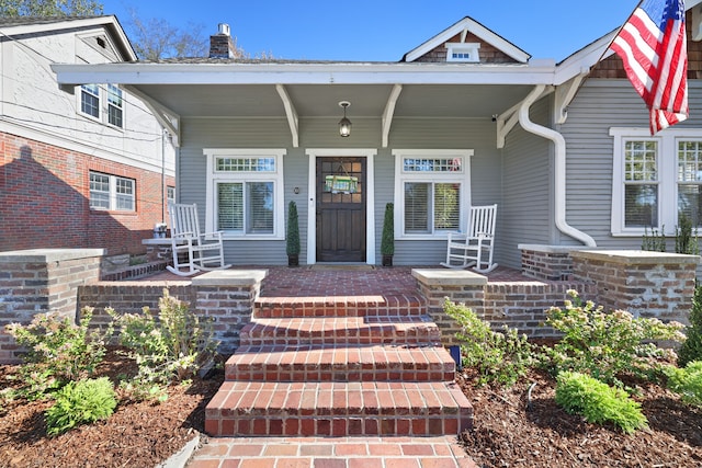 doorway to property featuring a porch