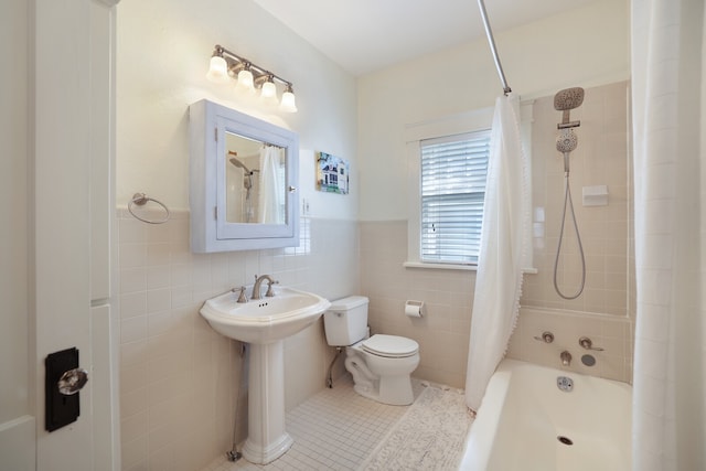 full bathroom with toilet, tile patterned flooring, sink, tile walls, and shower / bathtub combination with curtain