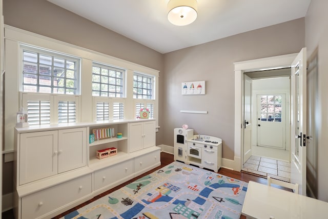 playroom featuring dark hardwood / wood-style flooring