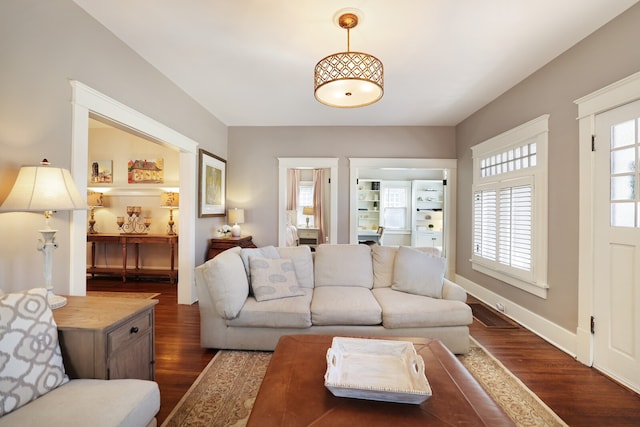 living room with dark hardwood / wood-style floors