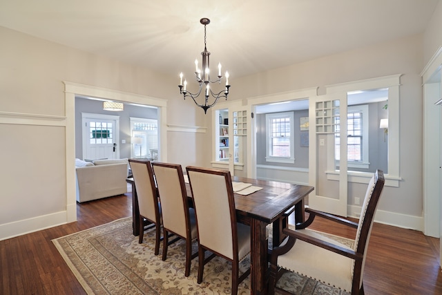 dining room featuring a chandelier and dark hardwood / wood-style flooring