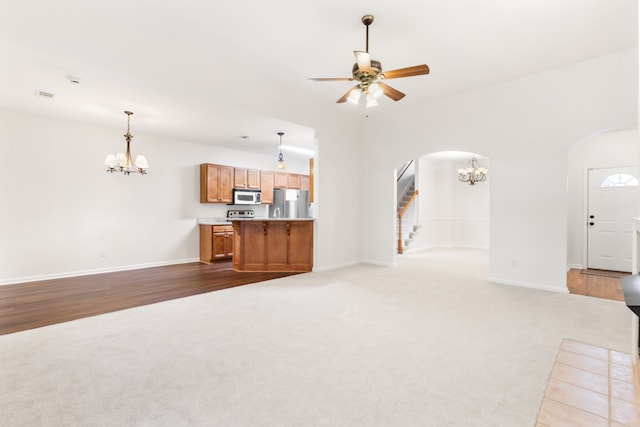 unfurnished living room with light hardwood / wood-style floors and ceiling fan