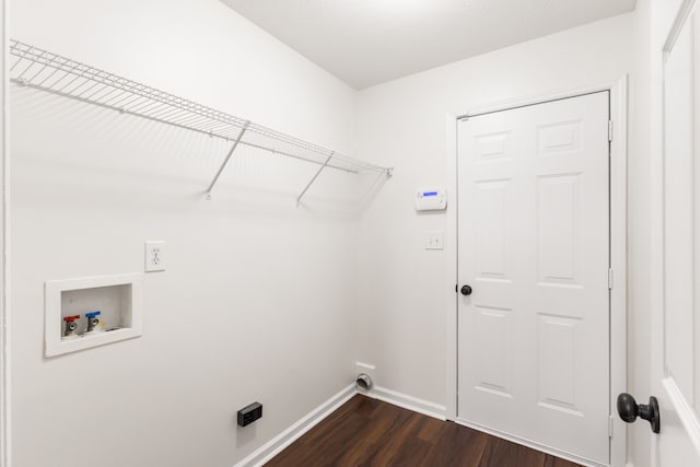 laundry room featuring washer hookup and dark wood-type flooring