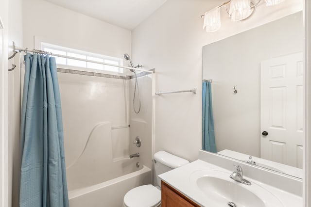 full bathroom with shower / bath combo, vanity, and toilet