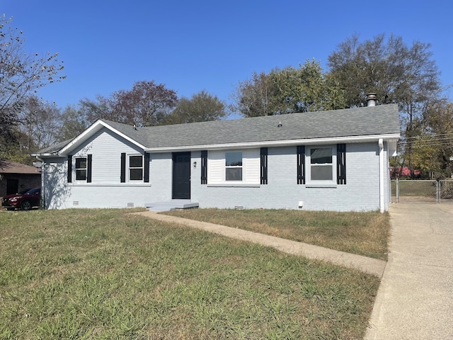 ranch-style home with a front lawn