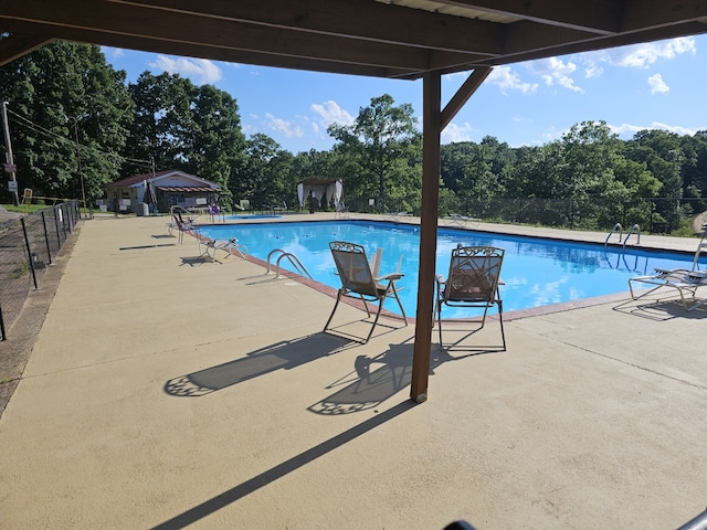 view of swimming pool featuring a patio