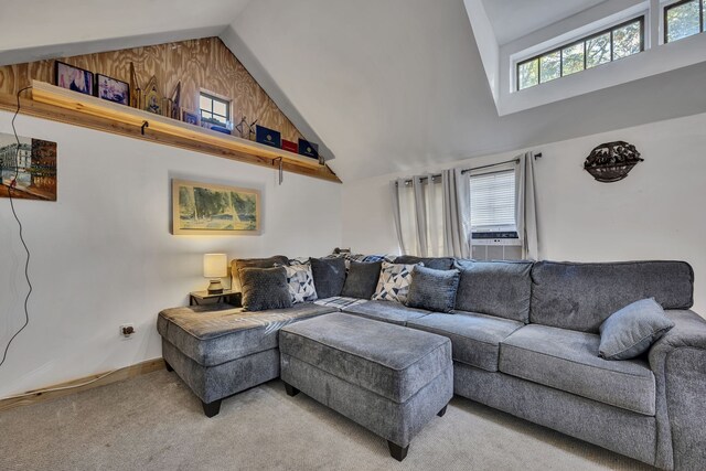 carpeted living room with wooden walls, cooling unit, and high vaulted ceiling