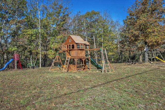 view of jungle gym featuring a lawn