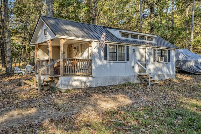 view of front of home featuring cooling unit and covered porch