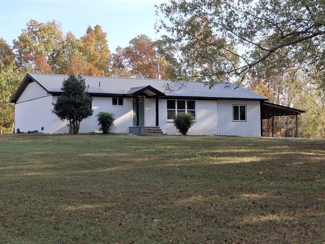 ranch-style house featuring a front lawn and a carport