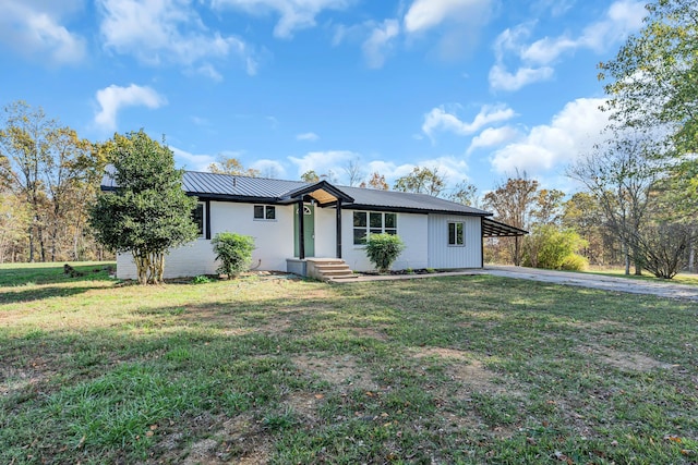 ranch-style house with a front lawn and a carport