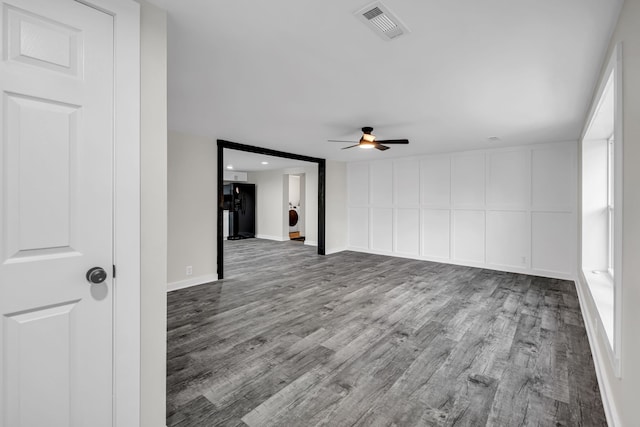 spare room featuring light hardwood / wood-style floors and ceiling fan