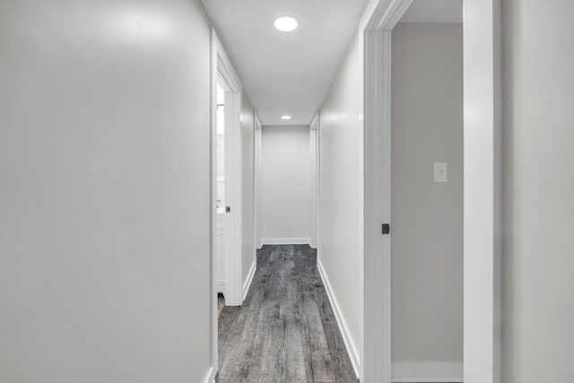 corridor featuring dark hardwood / wood-style floors