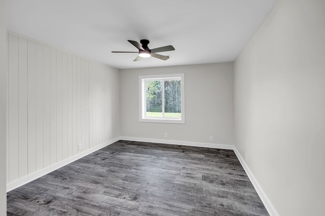 unfurnished room featuring ceiling fan and dark hardwood / wood-style floors