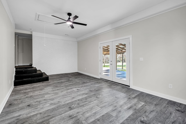 empty room with ornamental molding, french doors, and wood-type flooring