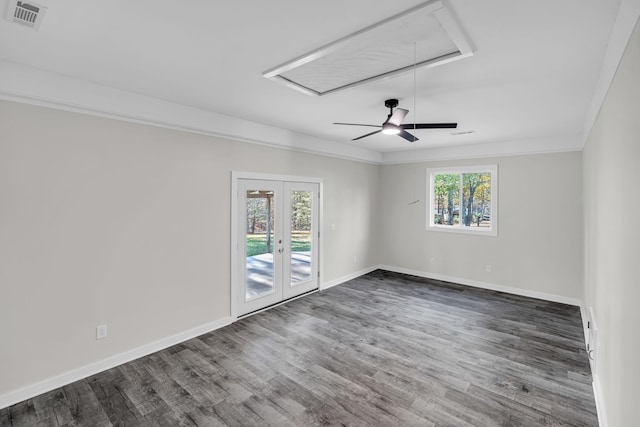 empty room featuring ornamental molding, dark hardwood / wood-style flooring, and a healthy amount of sunlight