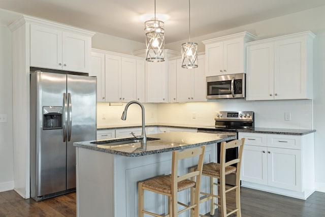 kitchen featuring decorative backsplash, stainless steel appliances, sink, and dark hardwood / wood-style flooring