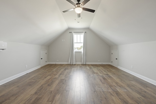 bonus room with ceiling fan, a wall mounted AC, lofted ceiling, and hardwood / wood-style floors