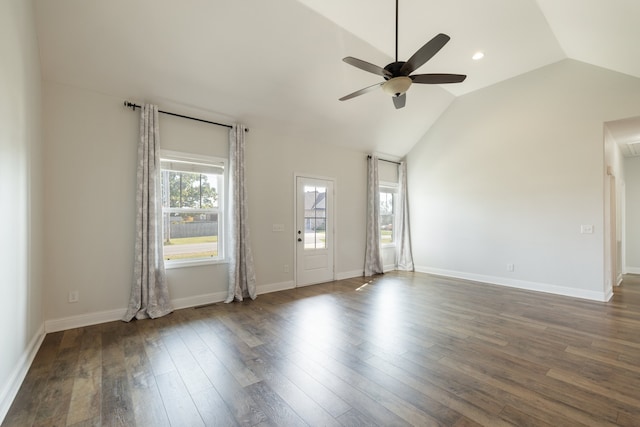 unfurnished room featuring vaulted ceiling, ceiling fan, and dark hardwood / wood-style flooring