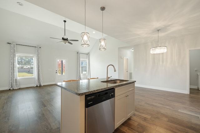 kitchen featuring a kitchen island with sink, stone countertops, sink, stainless steel dishwasher, and white cabinetry