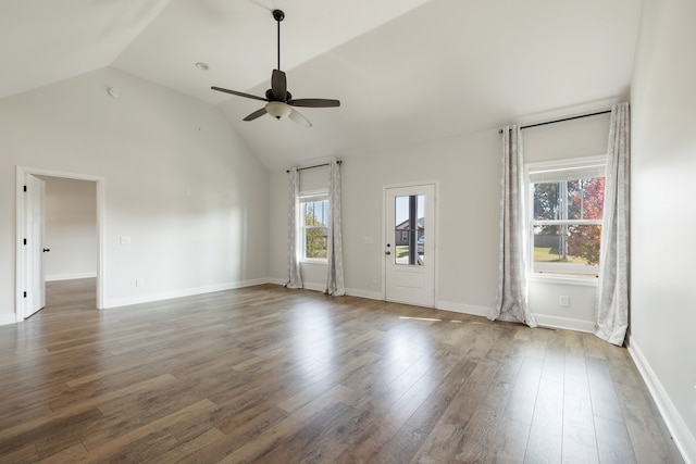 unfurnished living room featuring lofted ceiling, dark hardwood / wood-style floors, and ceiling fan