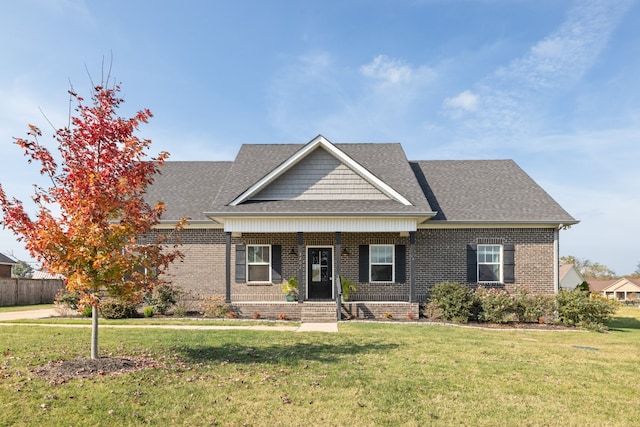 craftsman inspired home with a front lawn