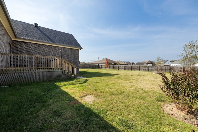 view of yard featuring a wooden deck