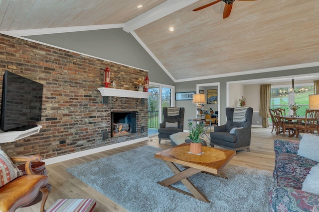 living room with light hardwood / wood-style flooring, beam ceiling, high vaulted ceiling, a brick fireplace, and wooden ceiling