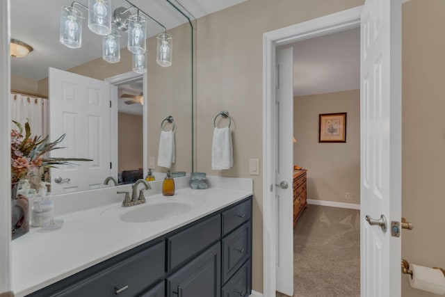 bathroom featuring ceiling fan and vanity