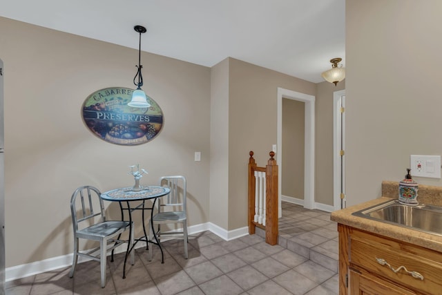 tiled dining area with sink