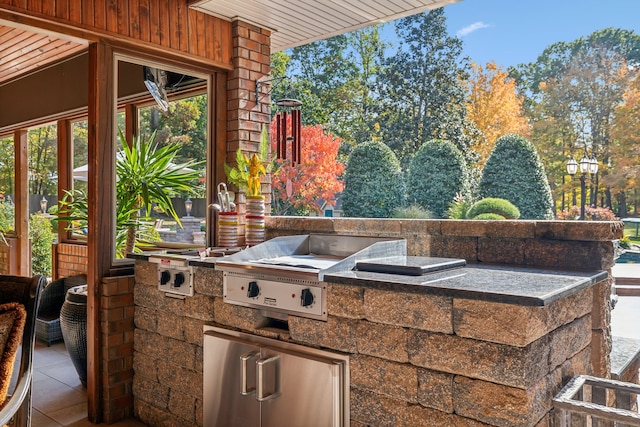 view of patio with a grill and exterior kitchen