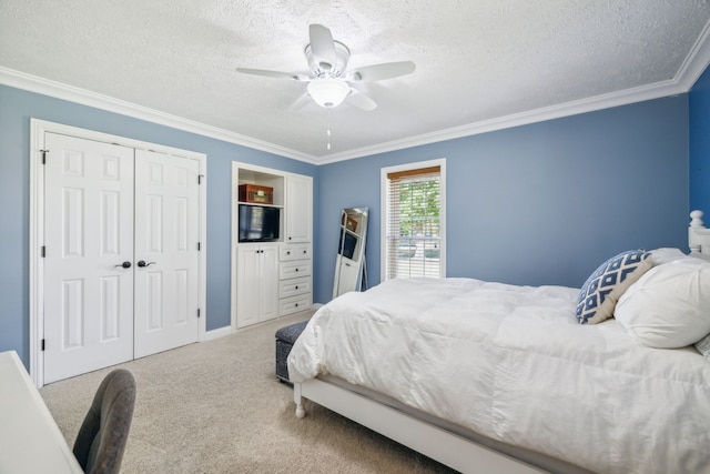 bedroom featuring a textured ceiling, carpet flooring, ceiling fan, and crown molding