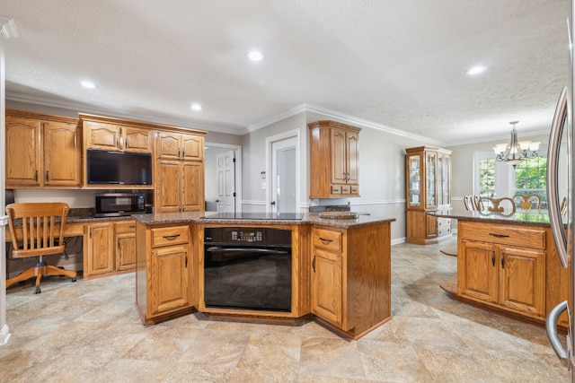 kitchen with black appliances, ornamental molding, hanging light fixtures, a kitchen island, and a notable chandelier