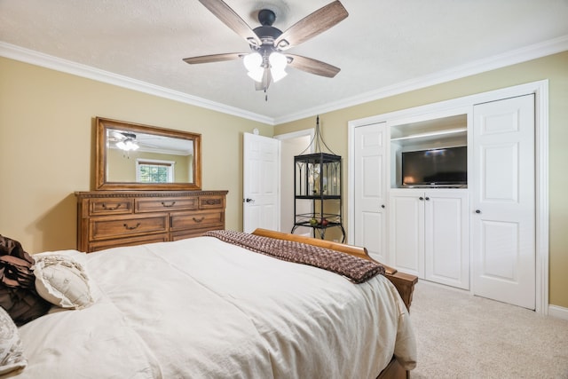 carpeted bedroom with a textured ceiling, ceiling fan, and crown molding