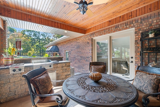 view of patio / terrace with ceiling fan and area for grilling