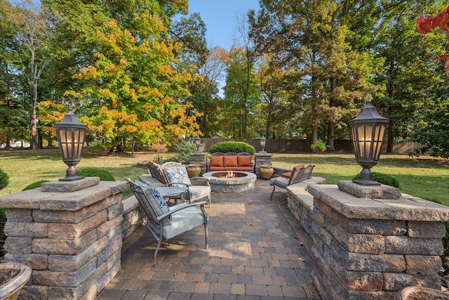 view of patio / terrace with an outdoor fire pit and a gazebo