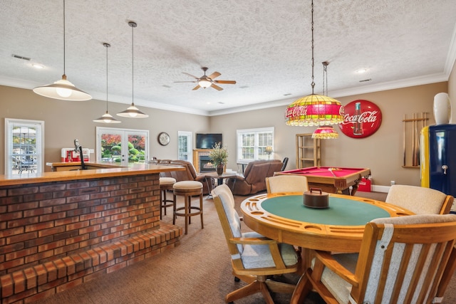 recreation room with a textured ceiling, carpet flooring, ceiling fan, and billiards