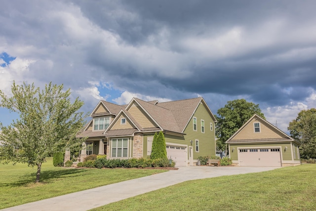 craftsman house with a front yard and a garage