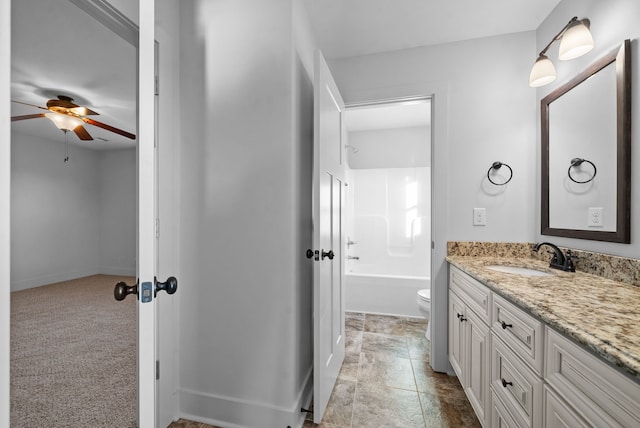 full bathroom with vanity, washtub / shower combination, toilet, and ceiling fan