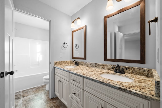 full bathroom featuring toilet, bathtub / shower combination, and vanity