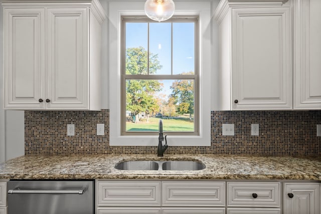 kitchen with white cabinetry, a healthy amount of sunlight, and sink