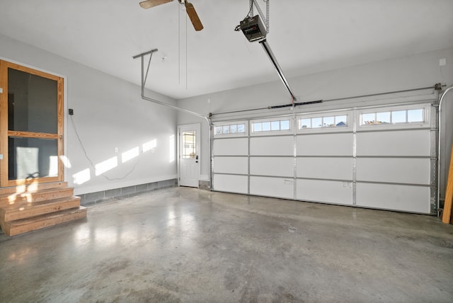 garage featuring a garage door opener and ceiling fan