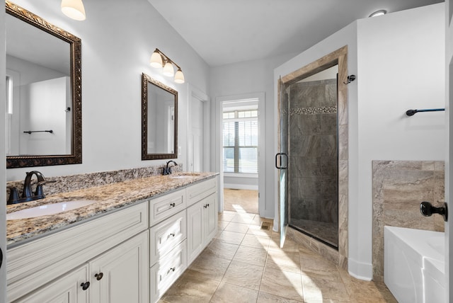 bathroom with vanity, shower with separate bathtub, and tile patterned flooring