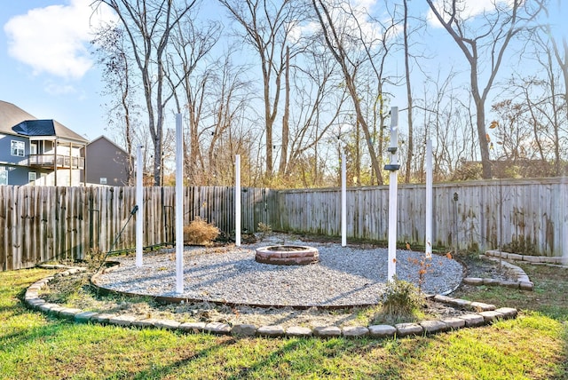 view of yard with a fire pit