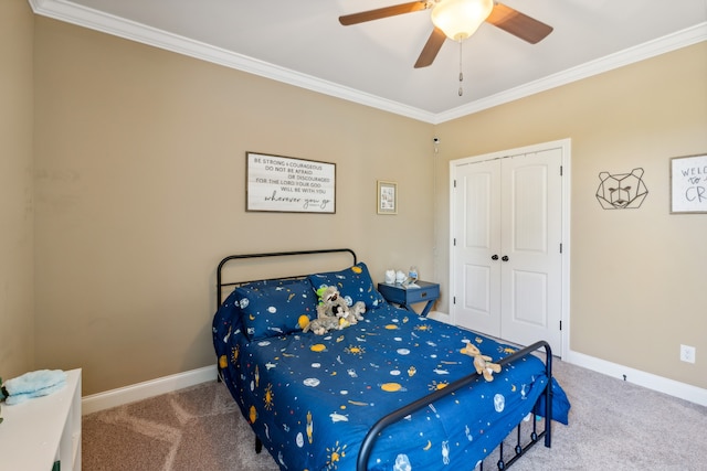 carpeted bedroom with crown molding, a closet, and ceiling fan