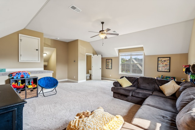 carpeted living room featuring ceiling fan and vaulted ceiling