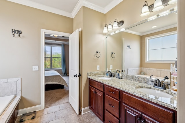 bathroom featuring vanity, ornamental molding, tiled tub, and tile patterned flooring