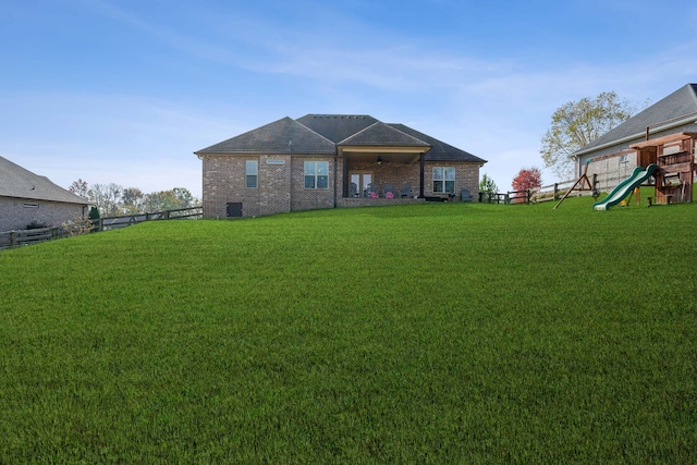 exterior space featuring a lawn and a playground