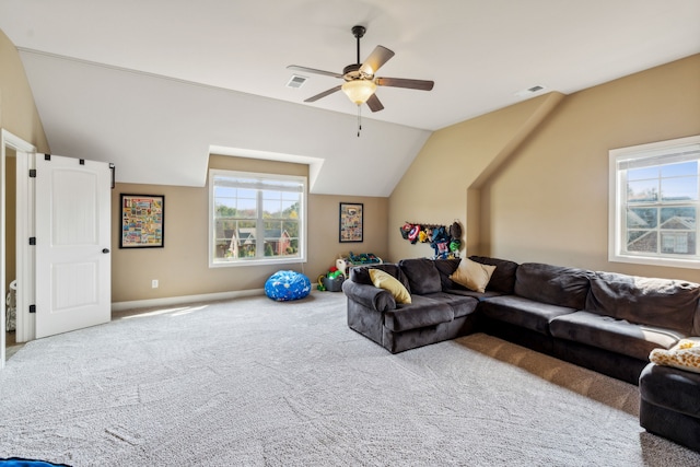 living room featuring lofted ceiling, carpet, and ceiling fan