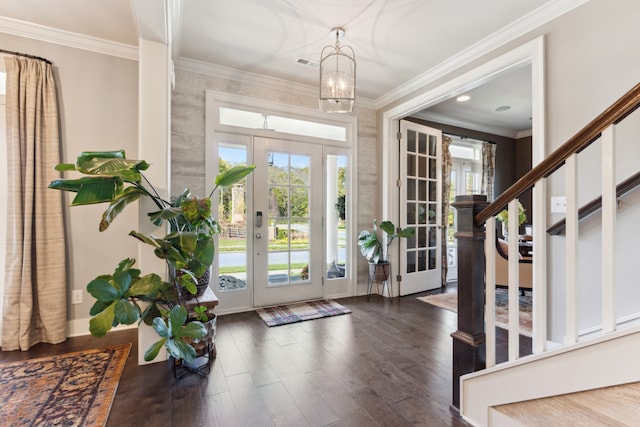 doorway to outside with crown molding, french doors, a chandelier, and dark hardwood / wood-style flooring